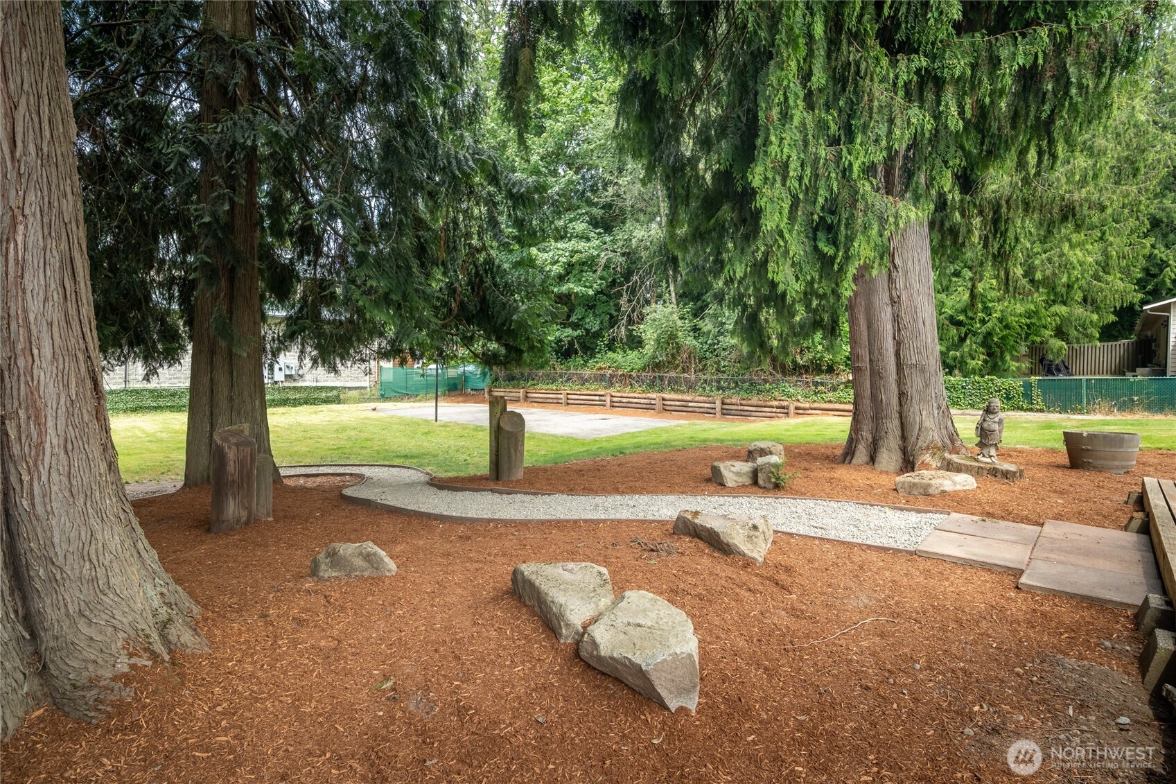 Winding path to sports court & out buildings