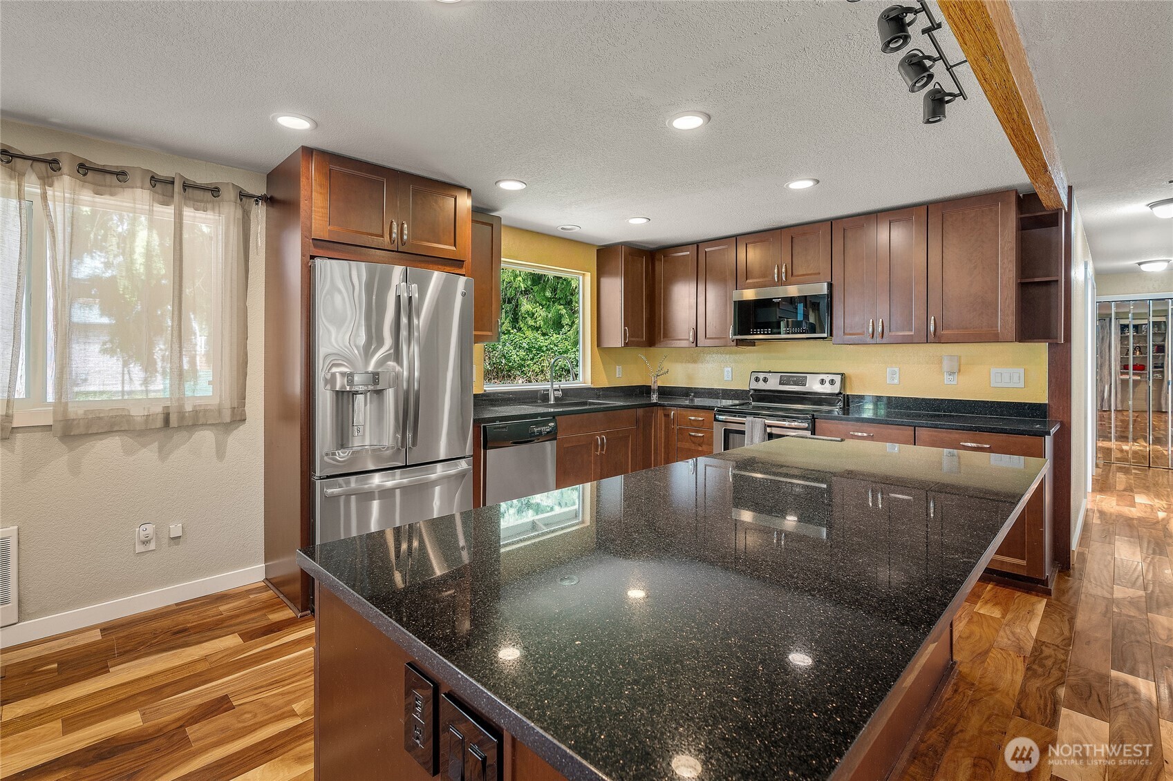 Kitchen features eating space and extra large island