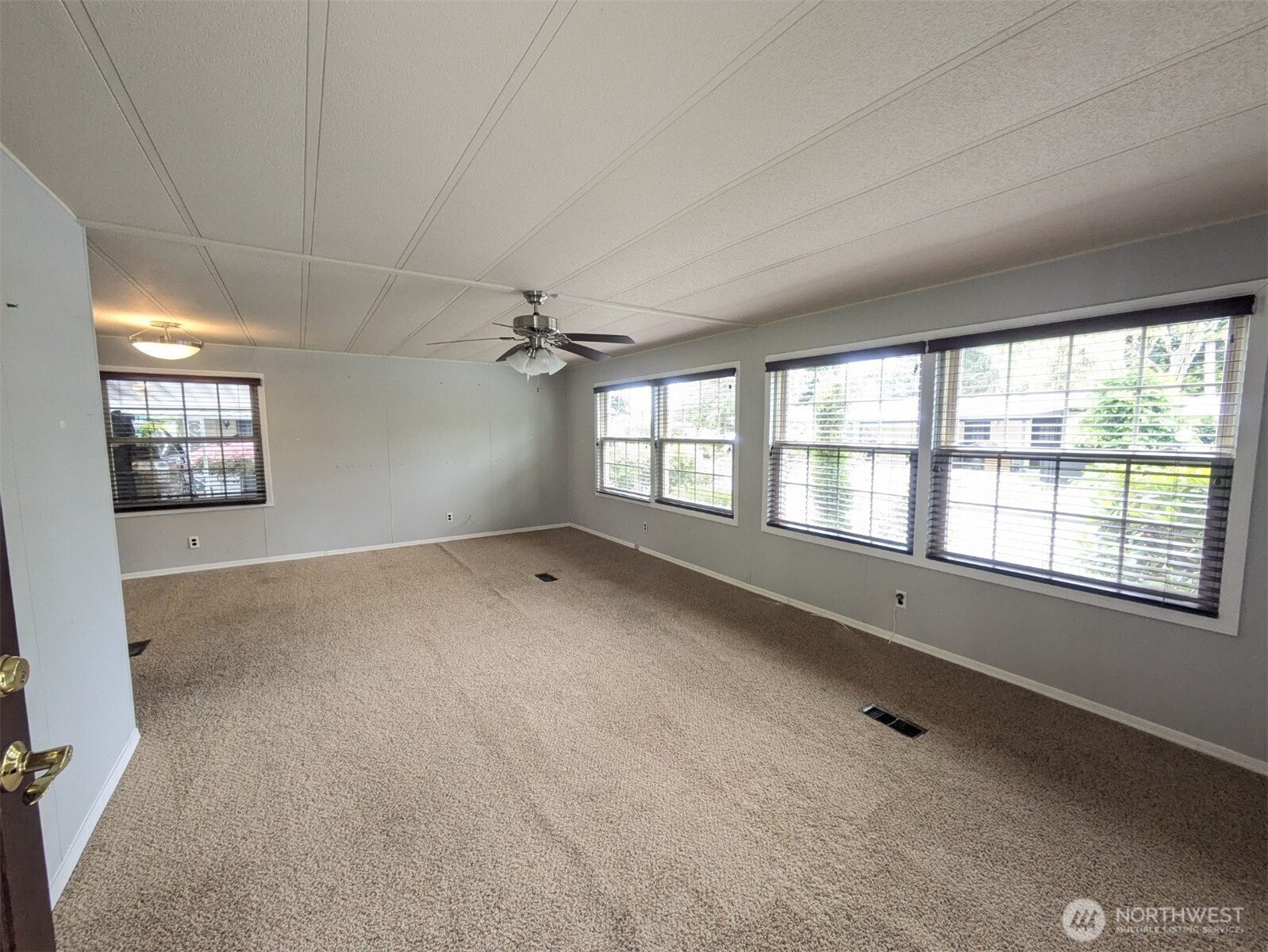 Front door entrance t living area. Big picture windows!