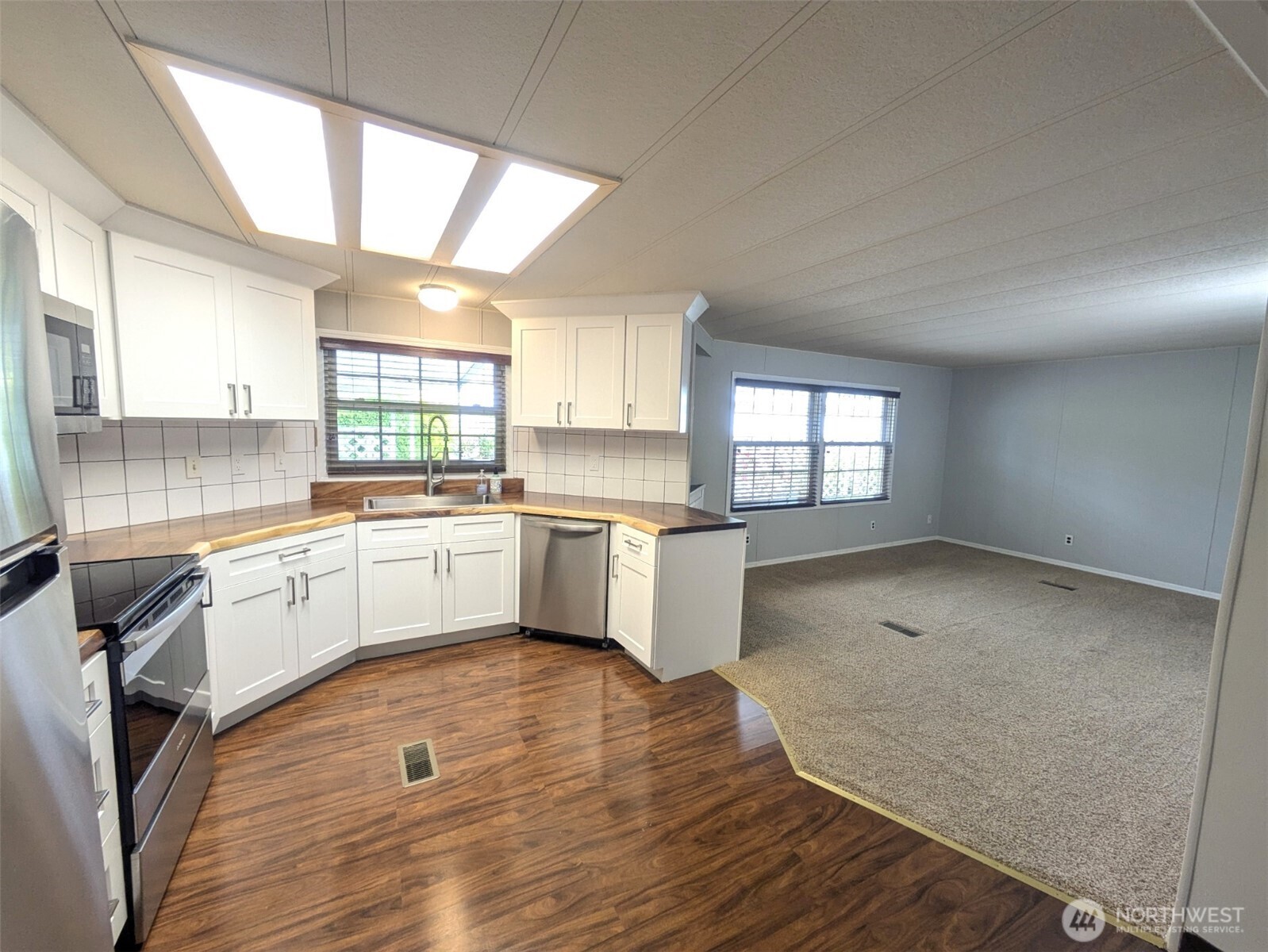 Open concept kitchen to family room. Newer stainless appliances and cabinets/countertop.