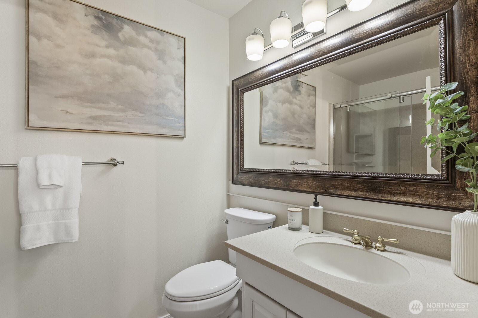 Shower with seamless glass barn door and 2nd vanity.