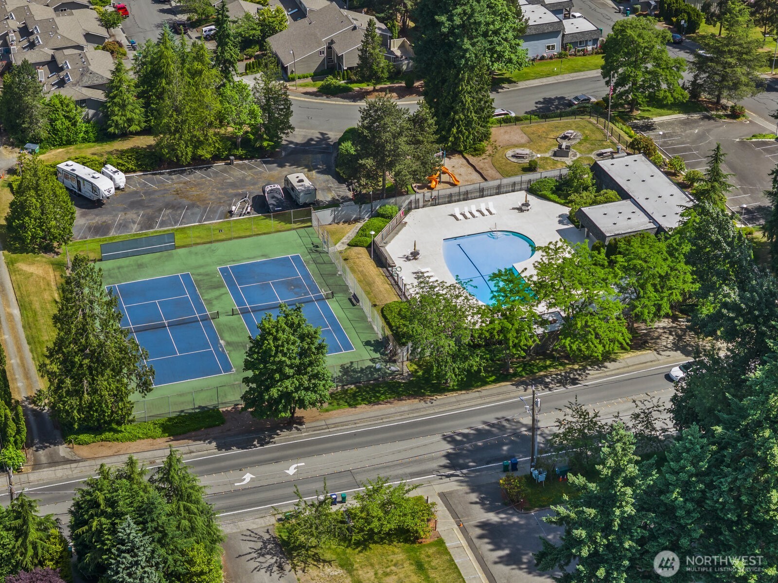 Enjoy resort amenities like the outdoor pool, club house, tennis courts and RV parking.