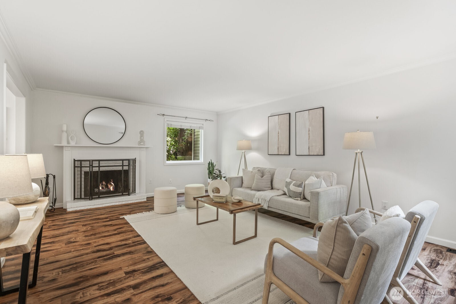 Spacious great room with elegant crown molding and cozy fireplace.