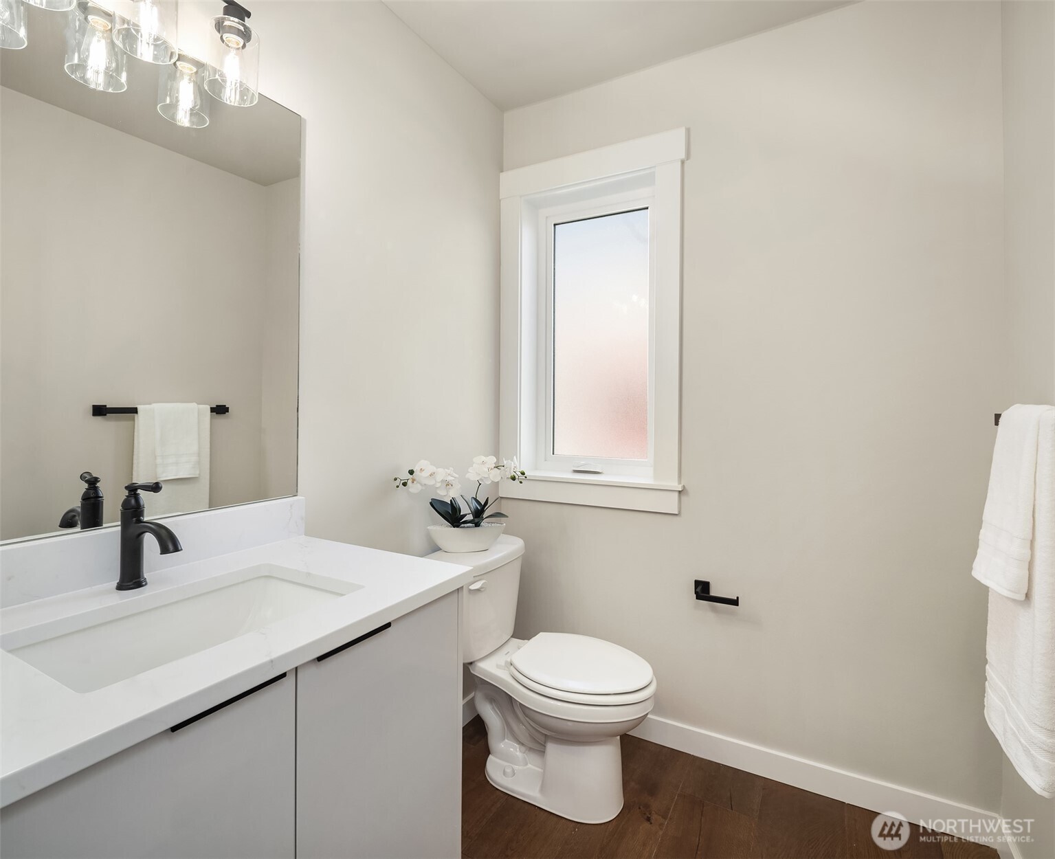 Conveniently located powder room on the second level