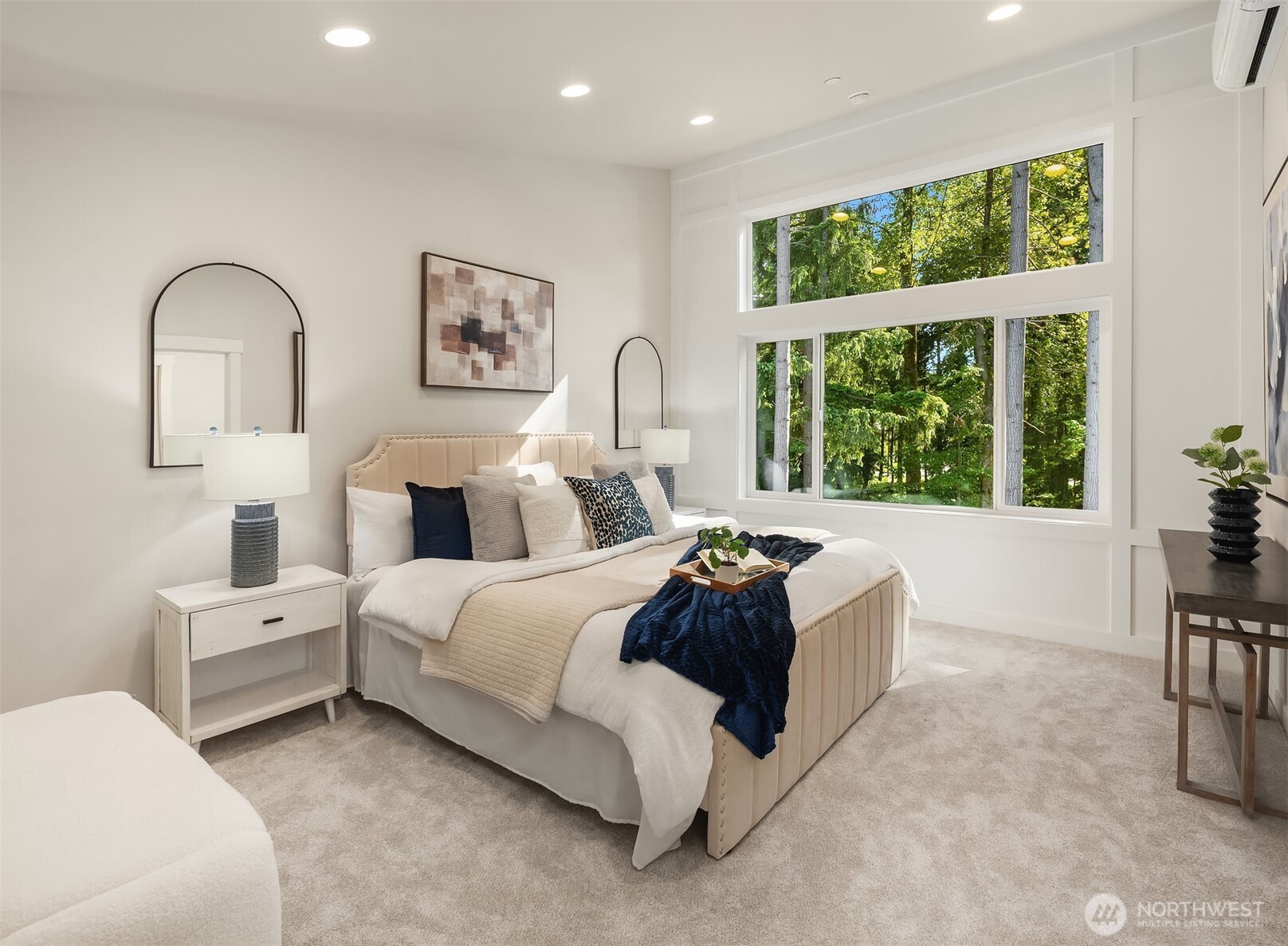 Luxurious primary suite featuring soaring vaulted ceilings