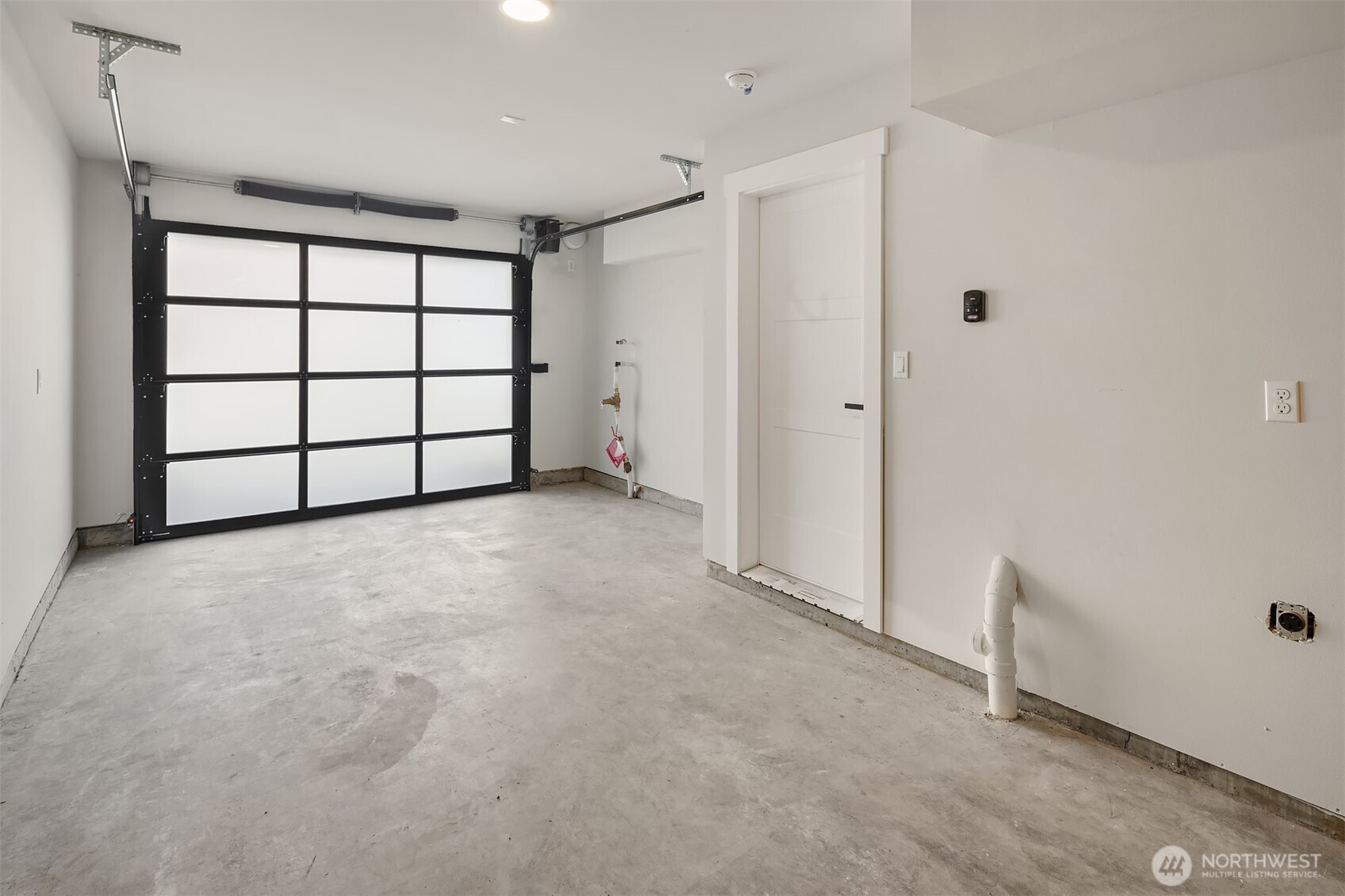 Well-planned nook for garbage and recycling bins.
