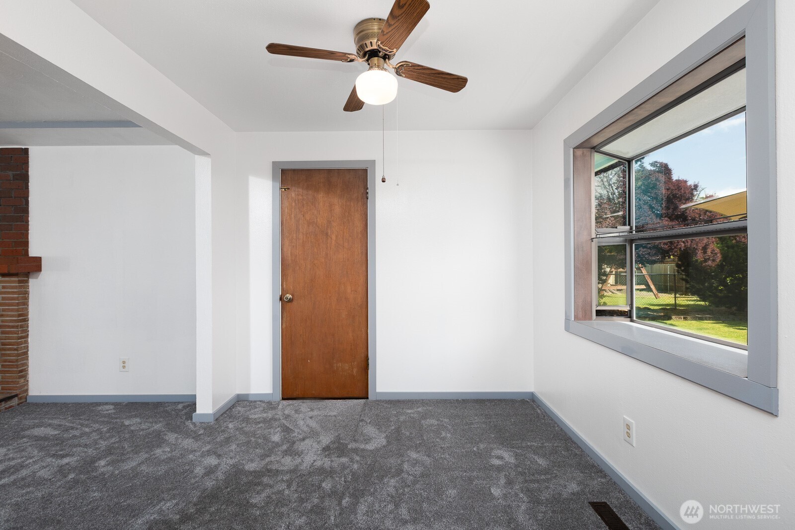 Dining room area with bay type garden window. Perfect for growing flowers or veggies! Ceiling fans are nice to help regulate the internal temperature.