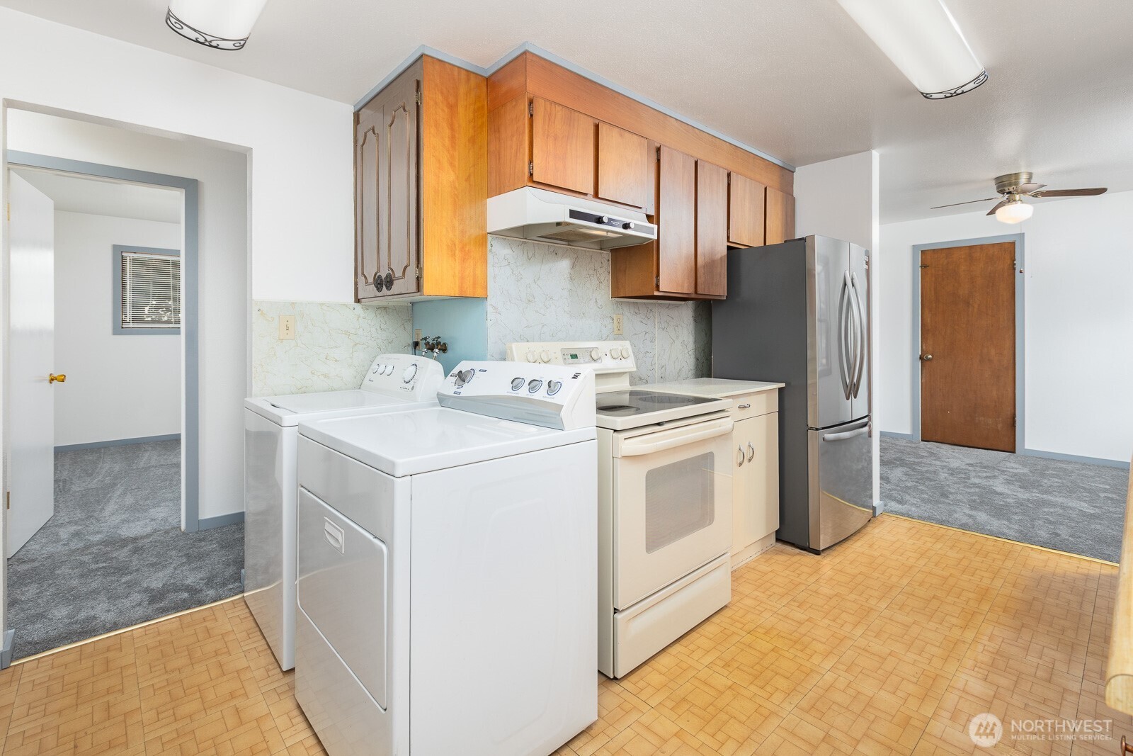 The owners had considered removing the cabinet and installing a stackable washer/dryer here. What do you think? What would you do?