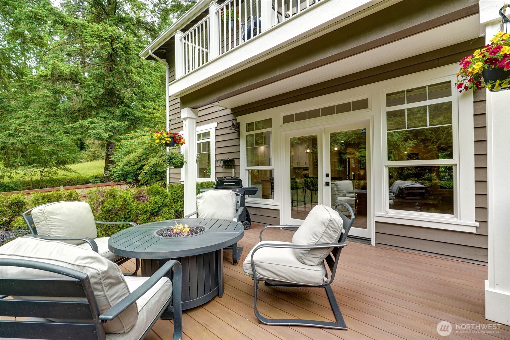 Spacious patio overlooking the beautifully landscaped backyard