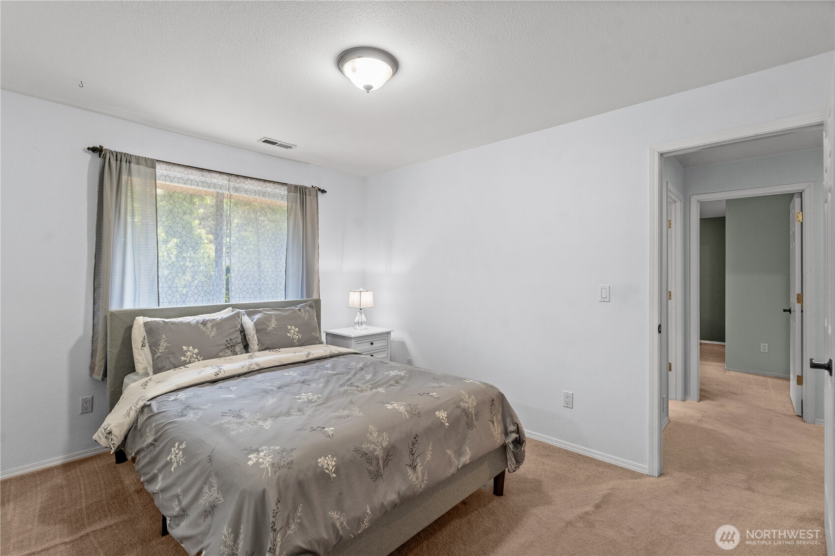 Spacious home office for 2 with built ins llooks out to the sunny front yard