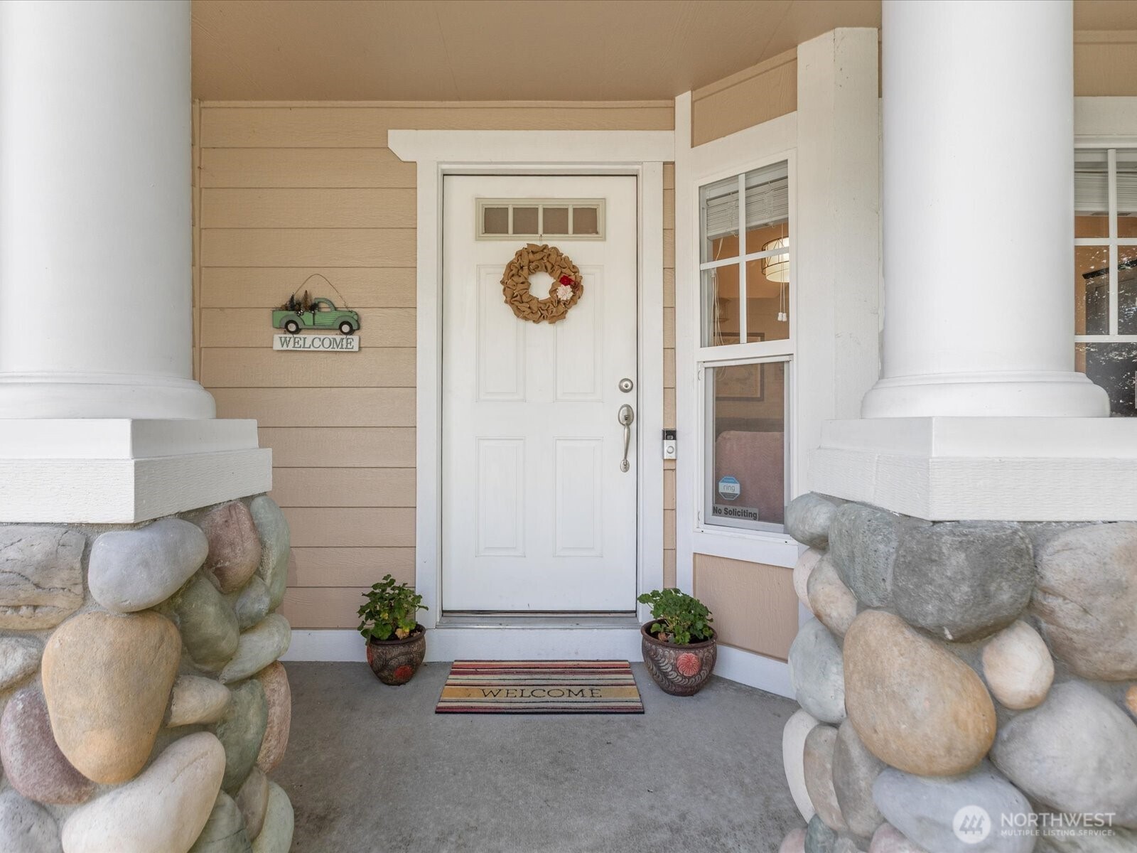 Welcoming front entry covered porch