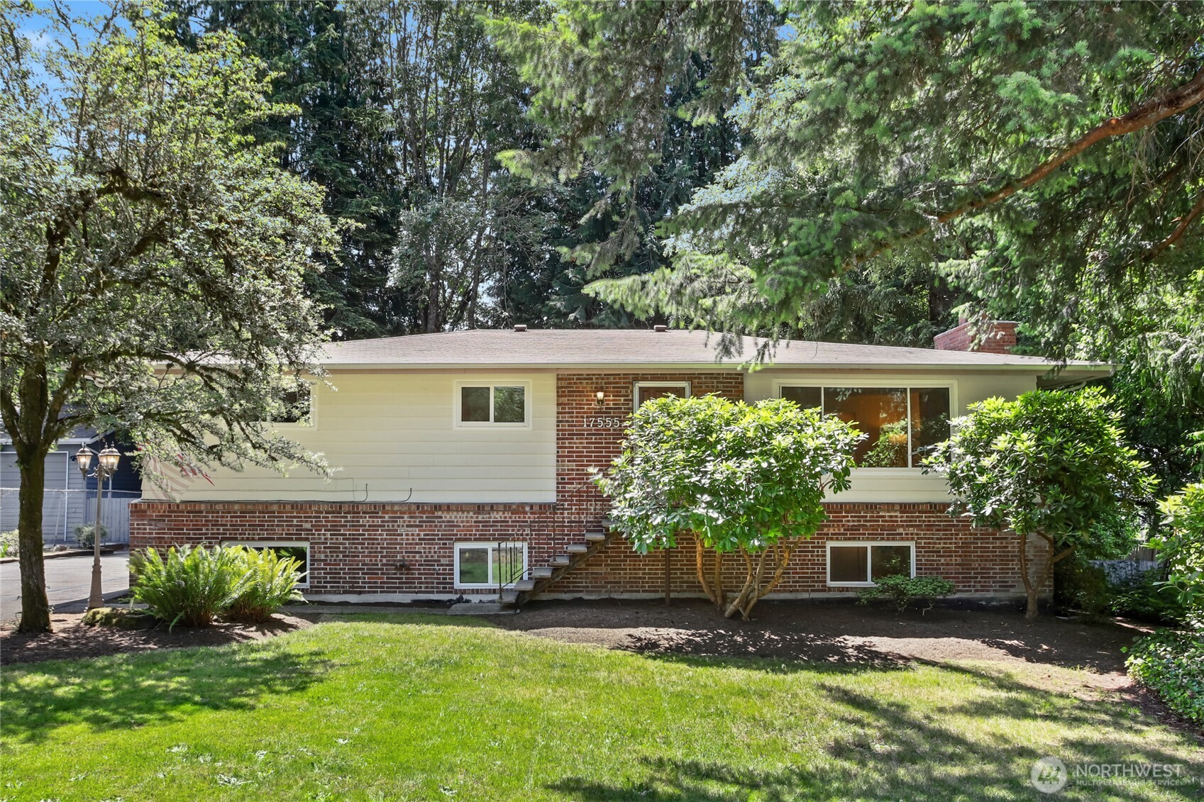 Fall all in love with this mid-century gem in the sought-after & awardwinning Issaquah School District. This pre-inspected 3,300 sqft home is less than 1 mile from Lake Kathleen. Lovingly maintained for 40 yrs with original hardwood floors that grace the main floor. The kitchen with SS appliances flows into the dining area is perfect for gatherings. The Lower level has brand-new carpet, a huge Rec Room with fireplace & versatile flex space. Enjoy afternoon shade on the spacious deck overlooking serene, fenced backyard with mature landscaping. Detached 2-Car Garage includes workshop & storage room, plus a separate gardening shed. Plenty of parking - ideal for guests or RV parking. Perfect those wanting proximity to DT Renton or Issaquah.