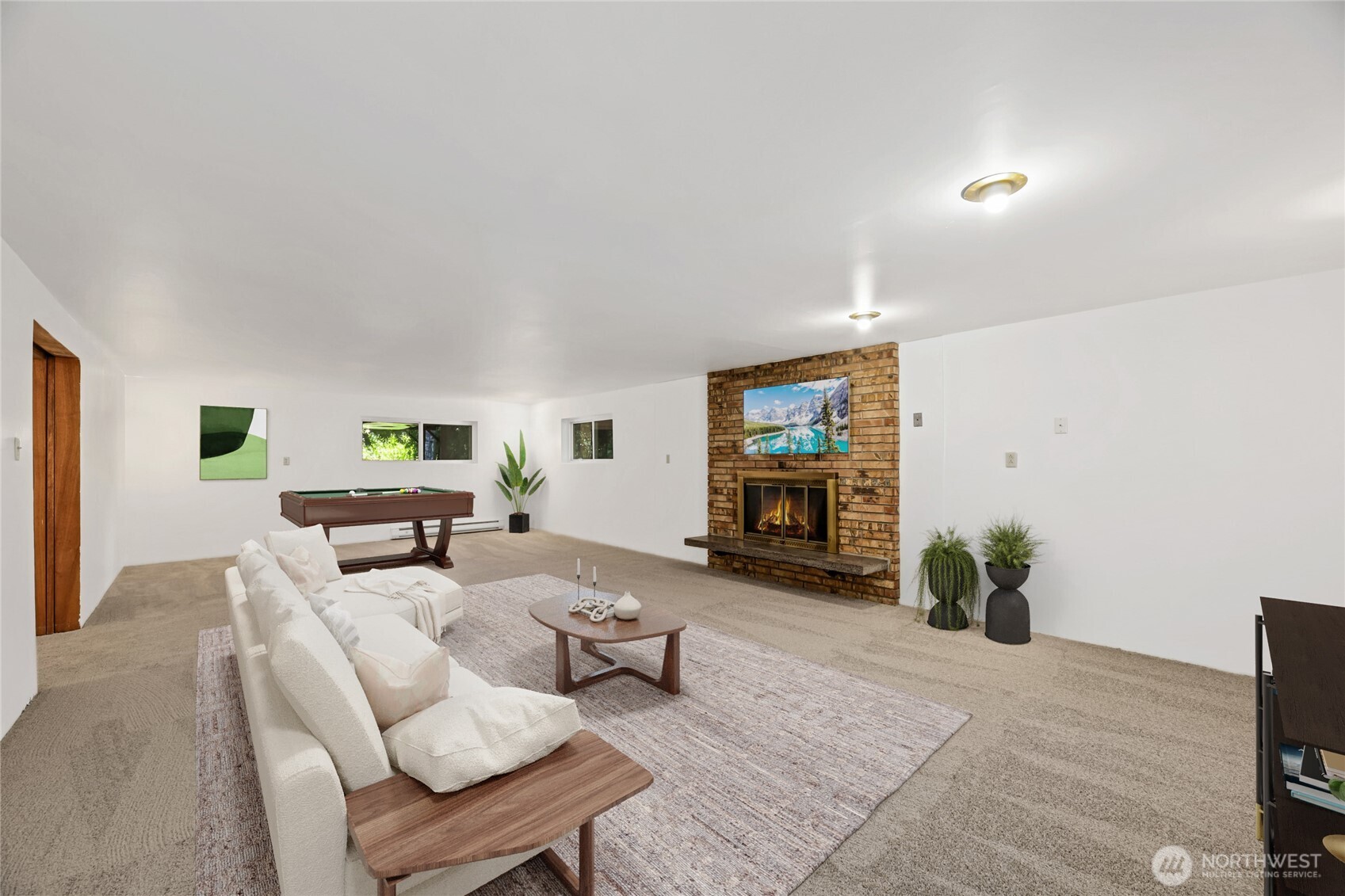 On the lower level, just past the versatile flex space, and the seperate laundry/storage room, there an enormous Rec room with brand-new carpet thorugh out. The huge Recreactional Room has fireplace & double pocket doors.