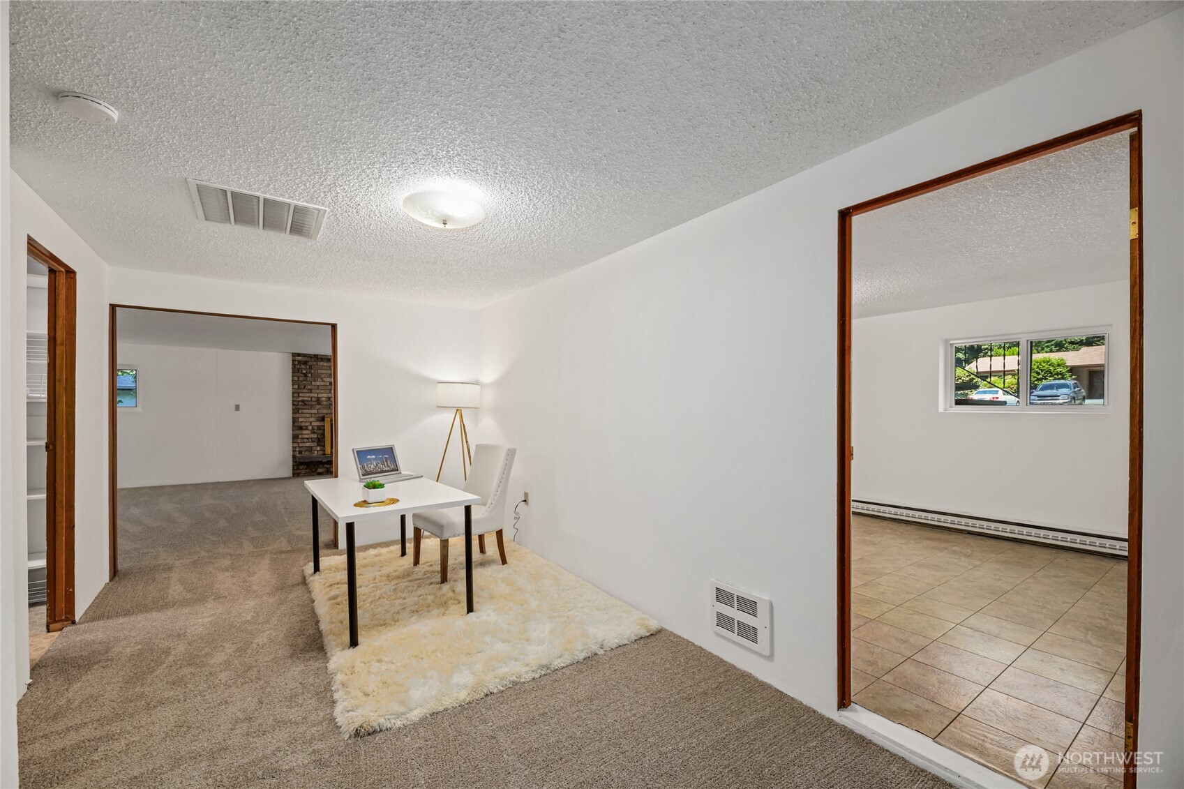 Versatile Flex Space to Rec Room with fireplace.