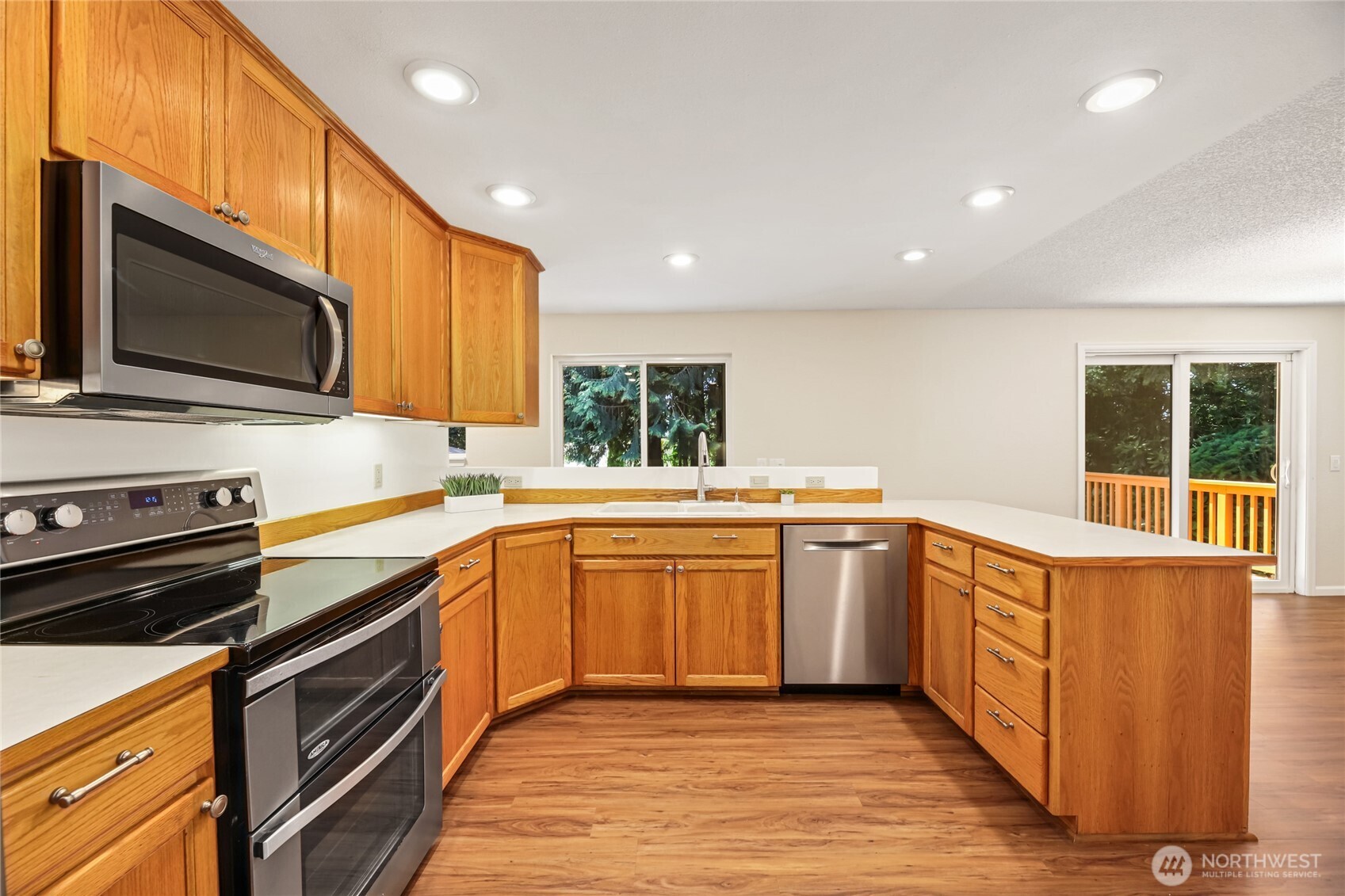 The kitchen has stainless steel appliances and plenty of storage. There's even a little panty off to the side of the kitchen. The upper cabinets have under cabinet lights for ambience.