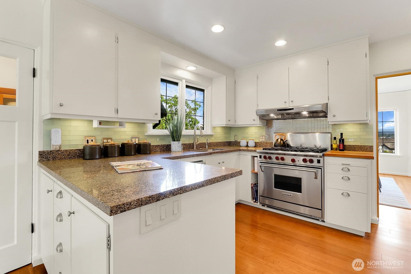Remodeled Kitchen Shows Granite Counters, A Full Set of Stainless Steel Appliances & Spacious Breakfast Nook!