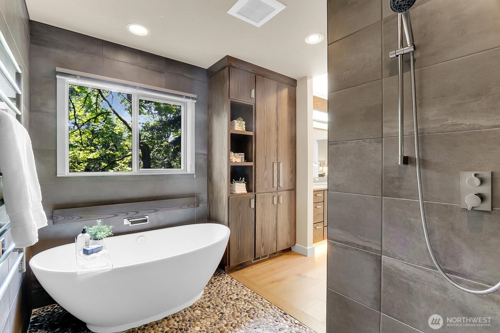 Spa-like sanctuary with window facing lush foliage