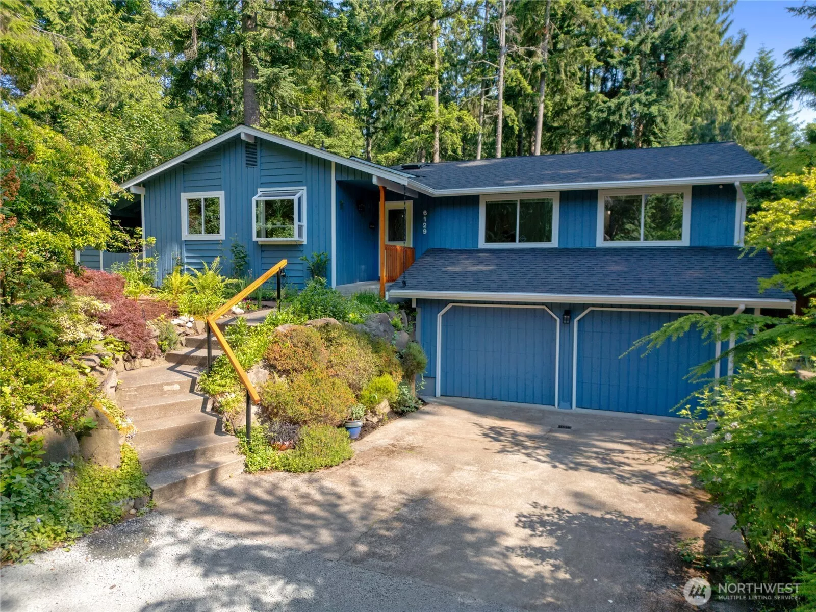 Secluded & Serene: Welcome to your private retreat nestled in the trees! Surrounded by lush native landscaping, this beautiful daylight rambler greets you with charming curb appeal and a peaceful setting on a park-like lot. The new roof and fresh exterior paint complete the crisp, move-in-ready feel.