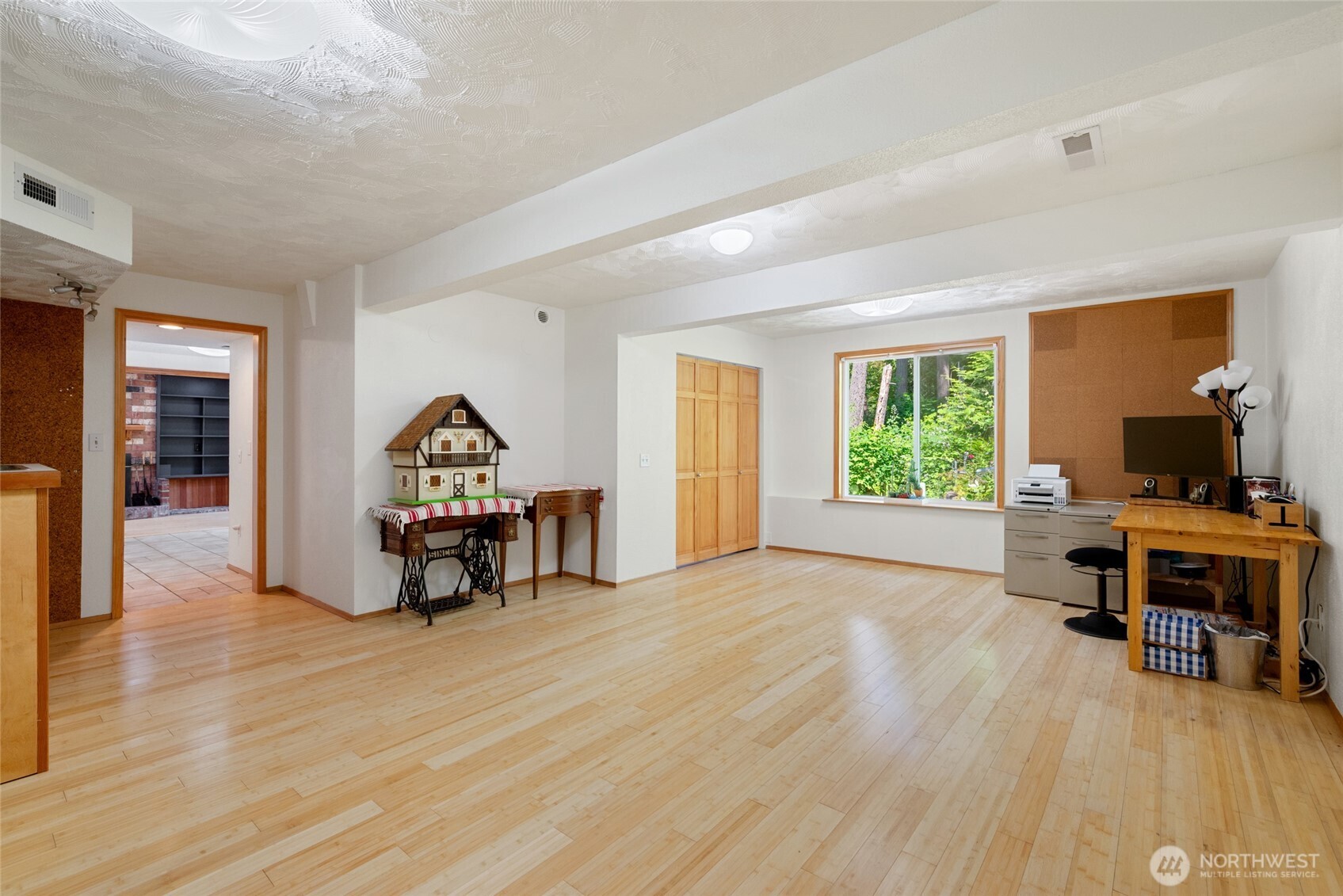 Lower-Level Bonus Room Versatile daylight basement space is perfect for a family room, home office, studio, or future ADU conversion. Large windows keep it bright and connected to the outdoors.