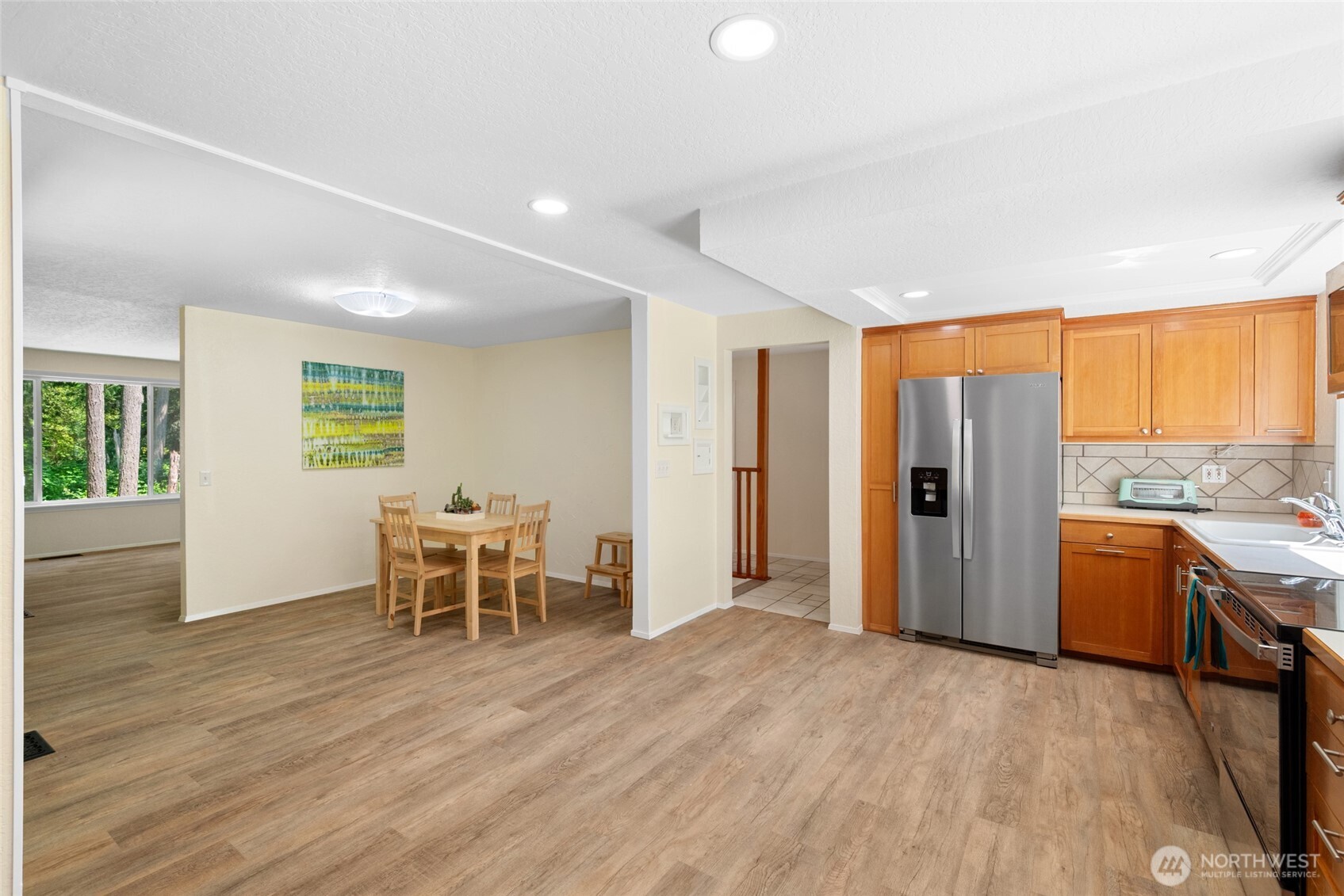 Open-Concept Flow. Flexible flow between kitchen, dining, and living. The open layout creates an easy flow from the kitchen to the adjacent dining and living rooms, ideal for both quiet nights at home and lively gatherings with guests.