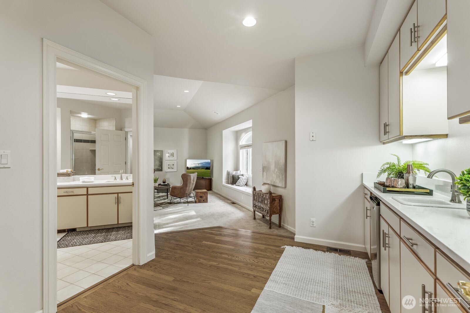 Large en-suite bonus room with closets, quartz wet bar area with beverage fridge, window seat with storage and a 3/4 bathroom.