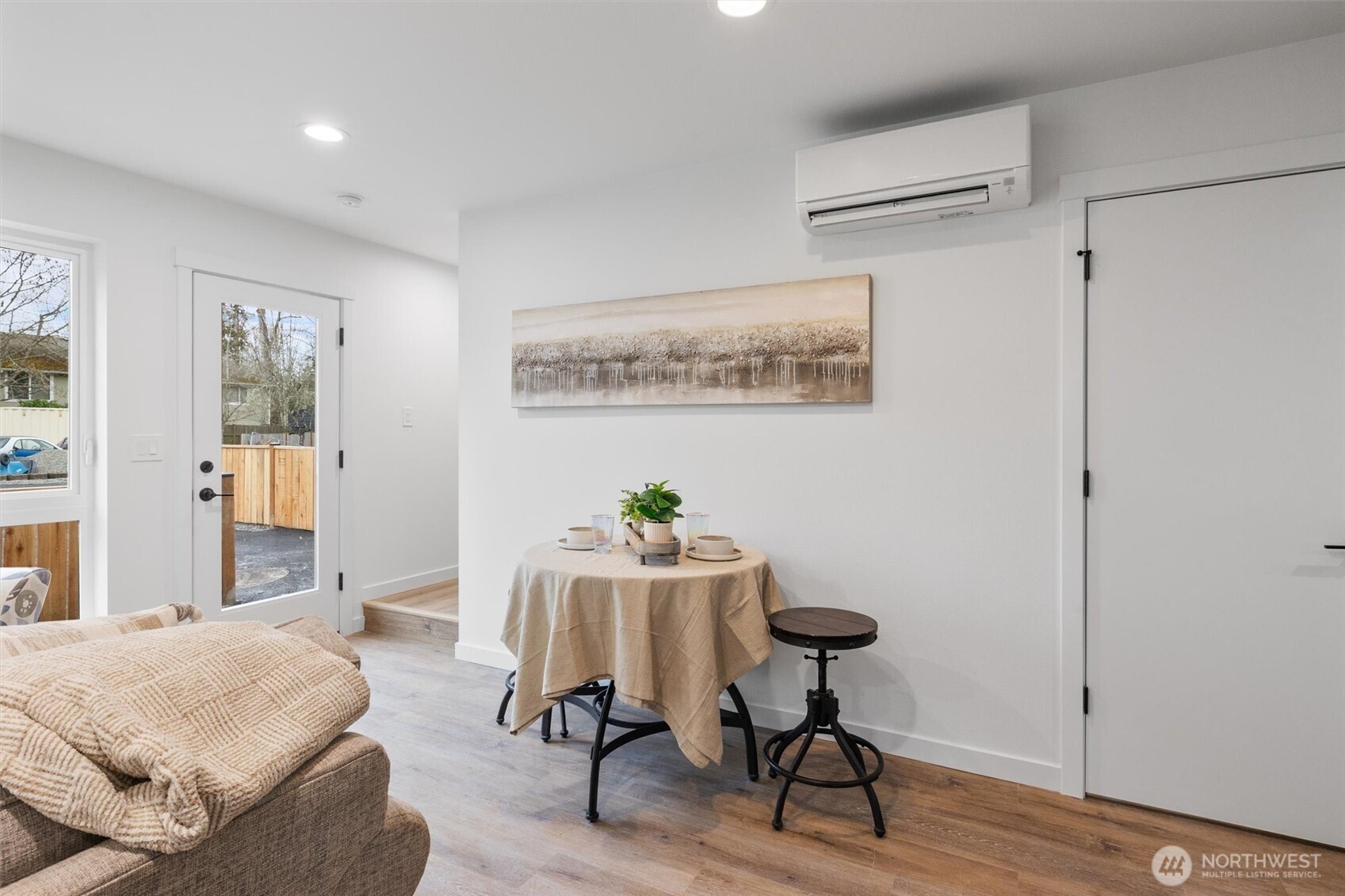 A charming dining nook is perfectly tucked near the entry, offering cozy functionality with modern style.