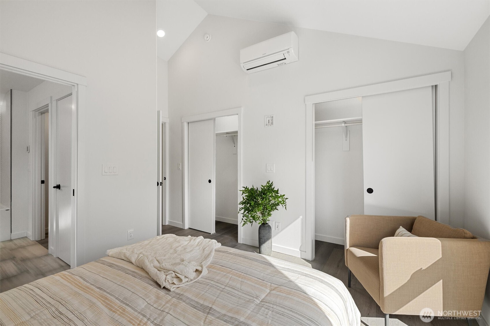 Dual closets and clean lines maximize both storage and style in the thoughtfully designed primary suite.