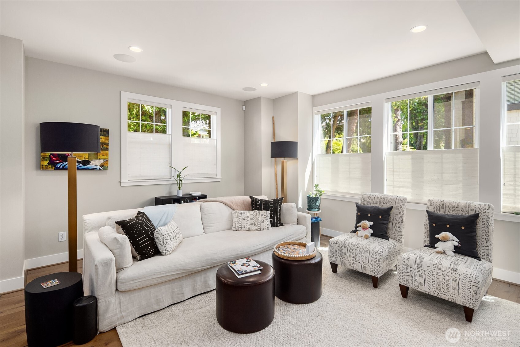 Large windows fill the home with natural light, complemented by top-down bottom-up shades that offer privacy, light control, and a touch of elegance.