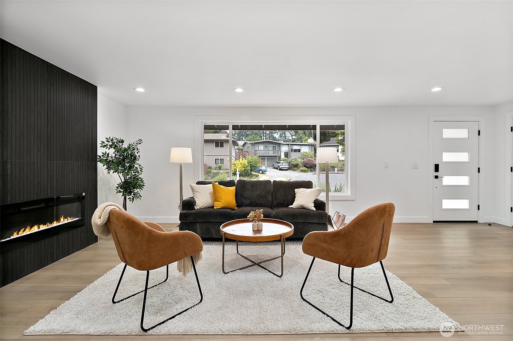 Main level living room with electric fireplace