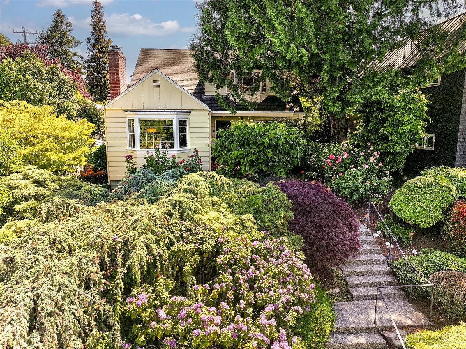 Perched on Boulevard frontage with a winding entry path, this 1941 Cape Cod welcomes you mere steps from the Laurelhurst Beach Club.