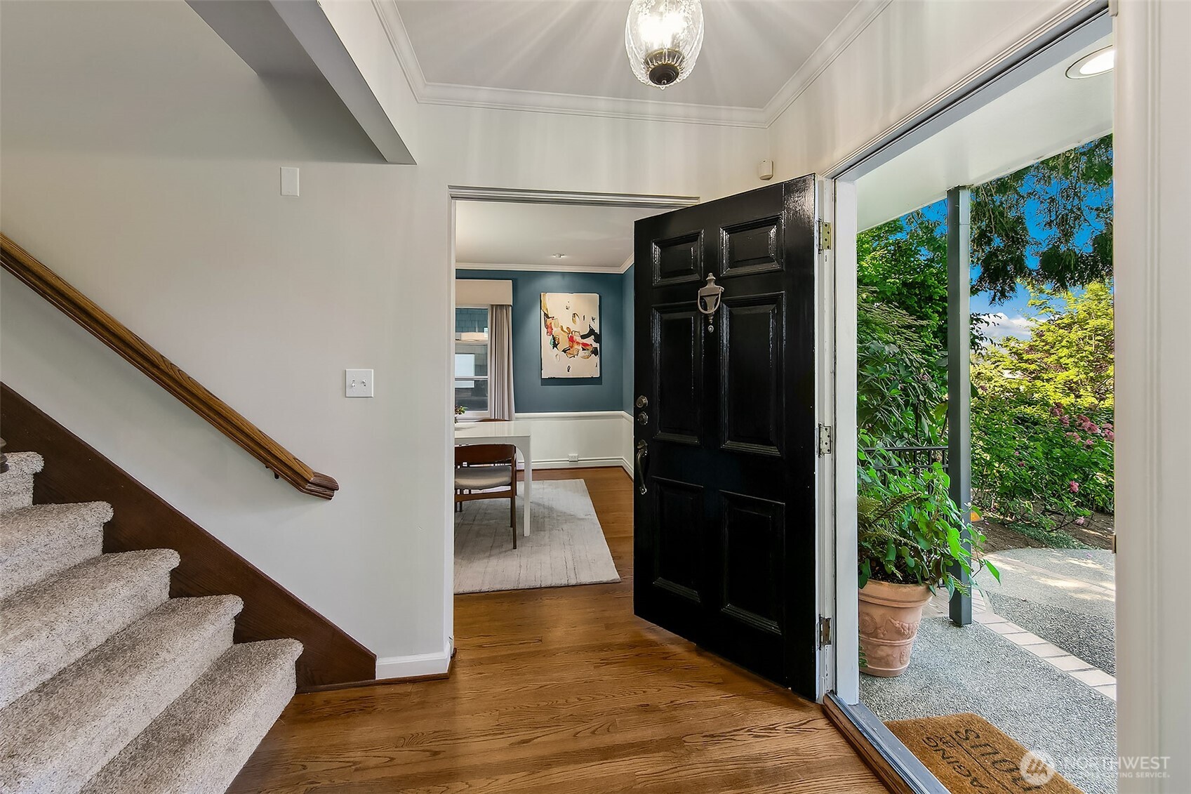 Through the classic foyer, a gracious staircase invites you upward to the skylit primary suite, where vaulted ceilings and serene retreat await.