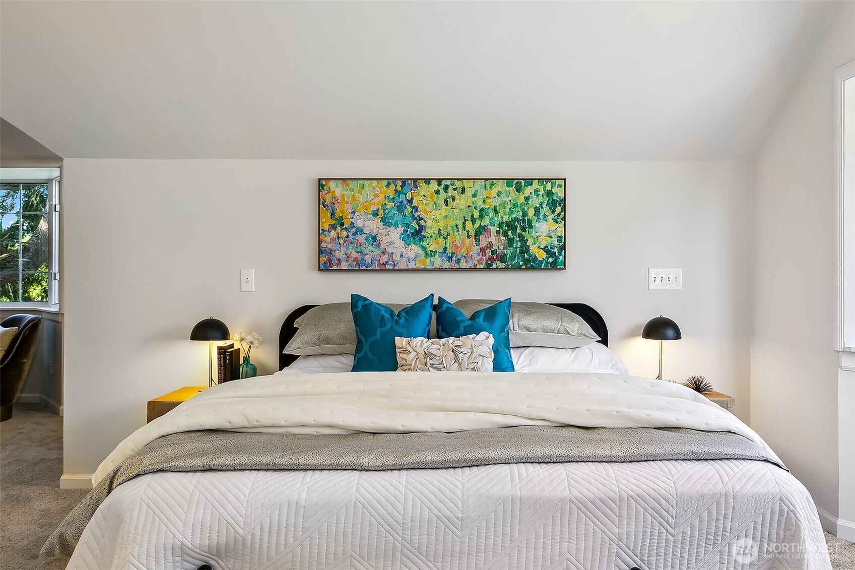 Vaulted primary suite spans the full upper level with open-concept flexibility—easily reconfigured per floor-plan options into separate bedroom, office or dual suites.