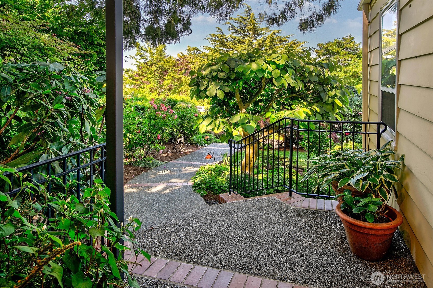 Detached two-car garage with alley access and adjacent gated entry—plus two additional off-street parking spaces for everyday ease and guest convenience.