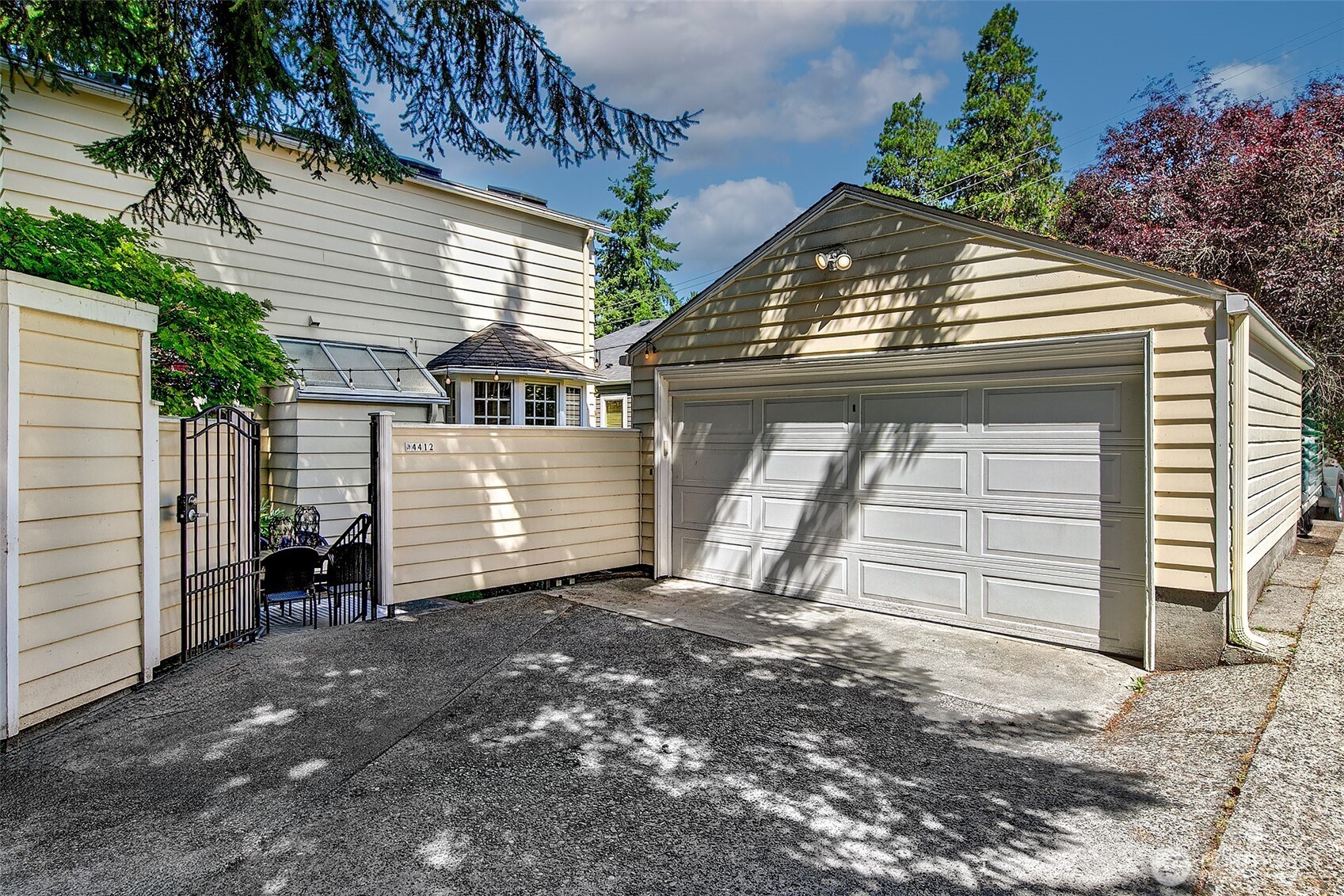 Aerial view reveals level access from the detached garage to the backyard terrace and side mudroom entry—ensuring seamless connection between parking and daily living.