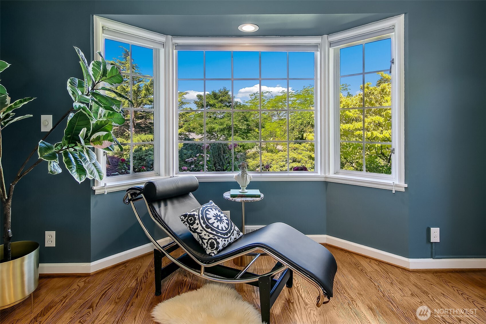 Bay-windowed office nook overlooking the tree-lined Boulevard, where serene views and abundant daylight inspire both work and repose.