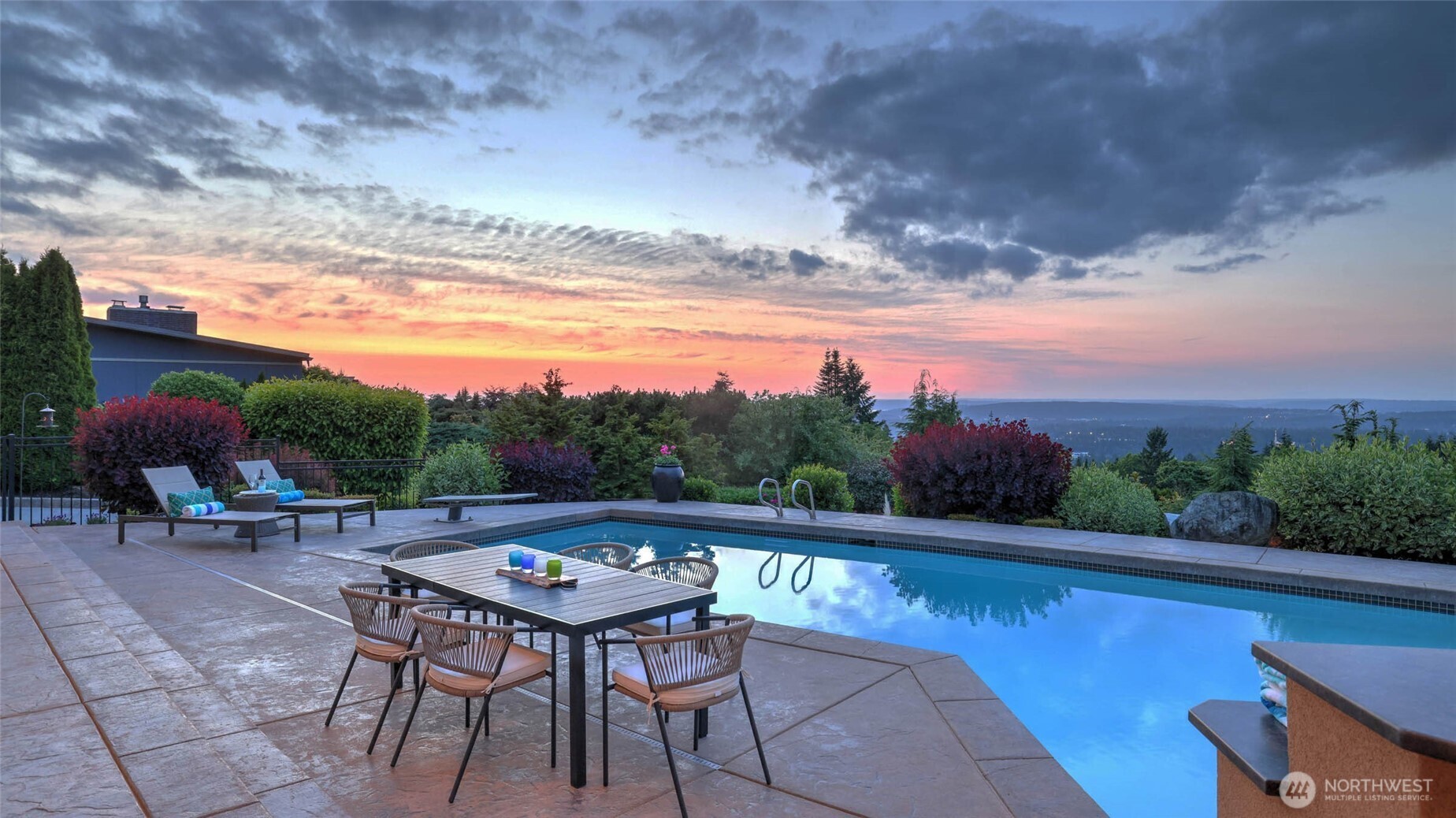The spacious pool deck invites relaxation and entertainment, while the low maintenance yard, equipped with a sprinkler system and abundant landscape lighting, ensures effortless upkeep.