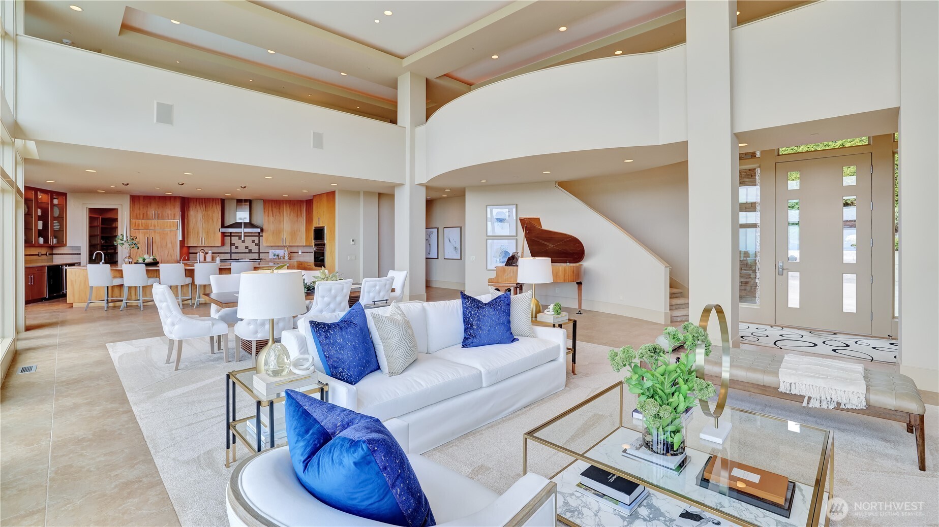 The great room offers generous spaces for multiple conversations and dining.