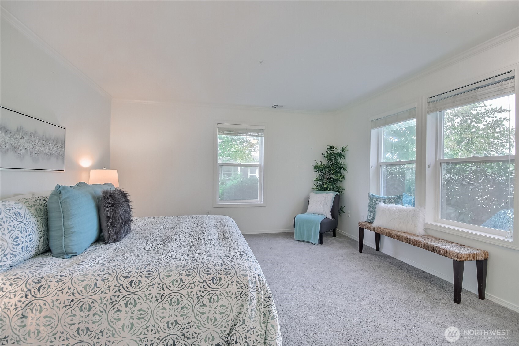 Primary bedroom suite with walk-in closet and 3/4 bath.