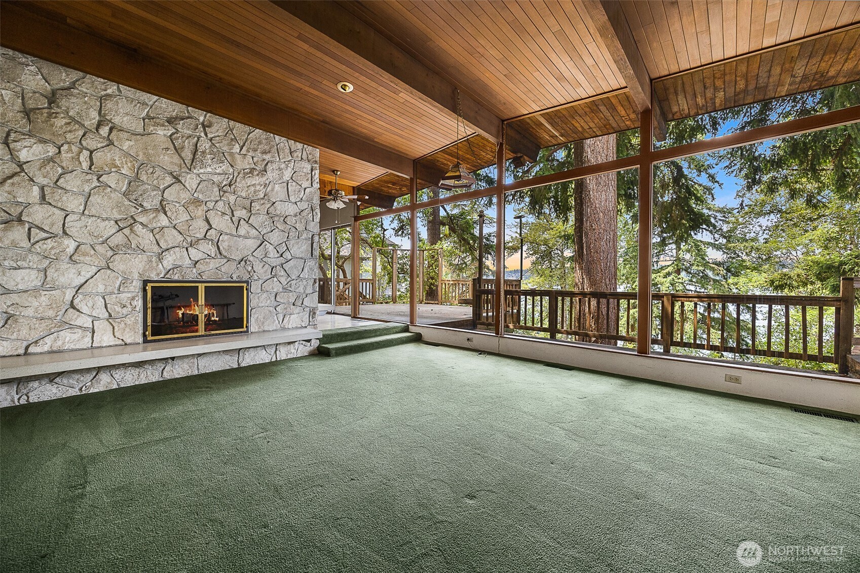 Formal living room all looking out at the lake.
