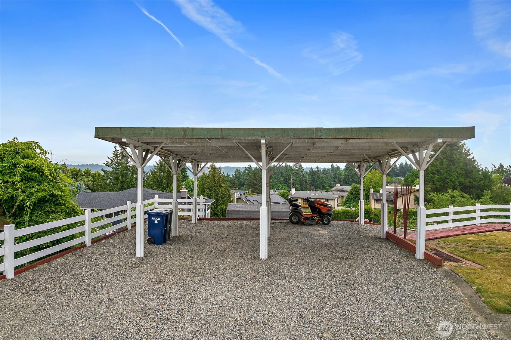 Large driveway with plenty of parking including a RV.