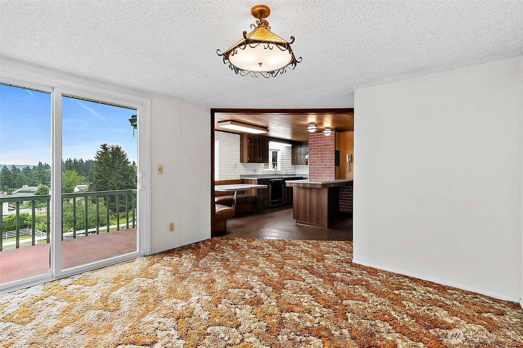 14x10 Dinning room with a slider to an upper deck.