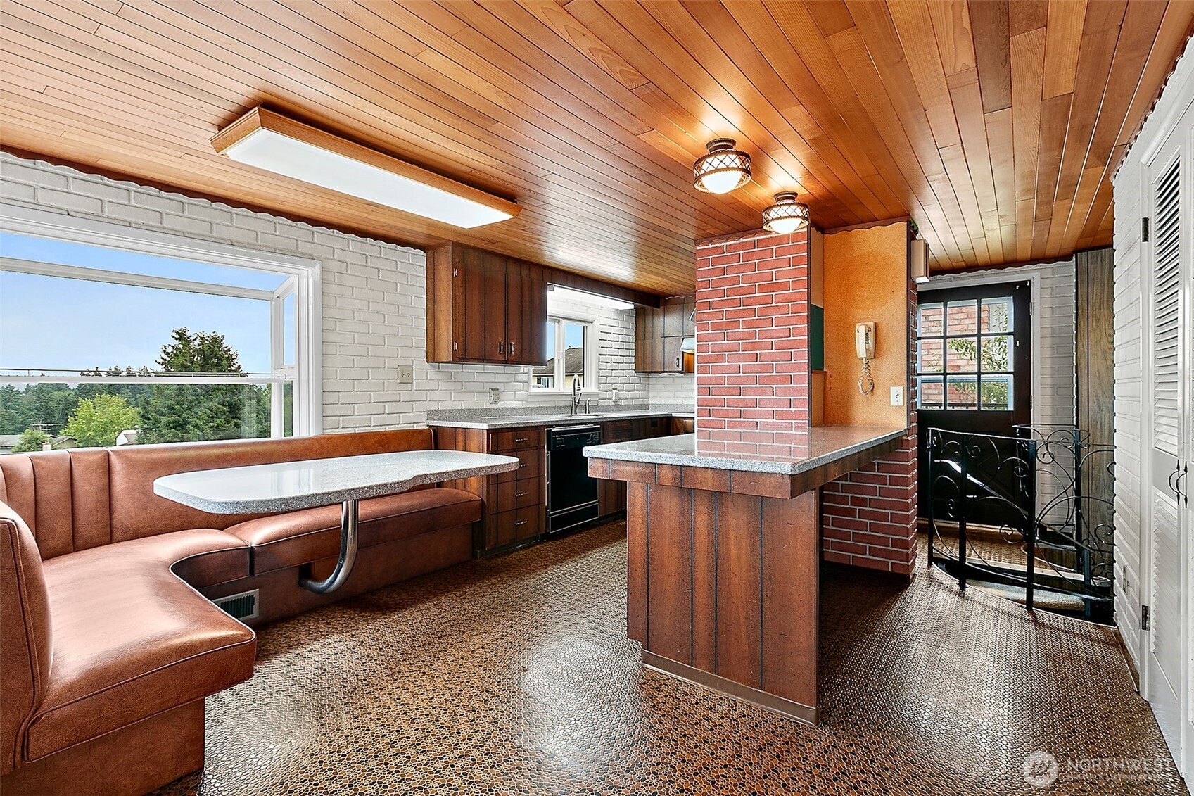 17x12 Kitchen with a spiral staircase to the lower level.