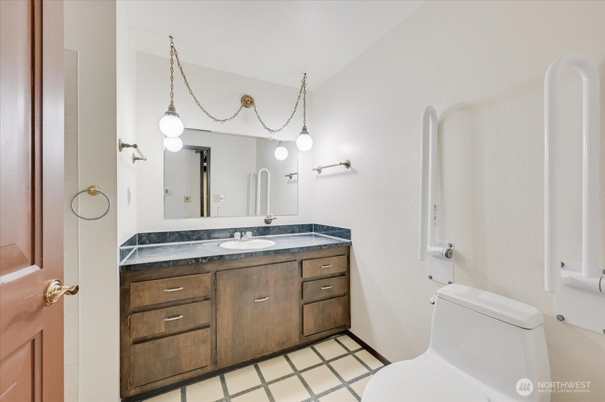 Main bath with wide door and grab bars
