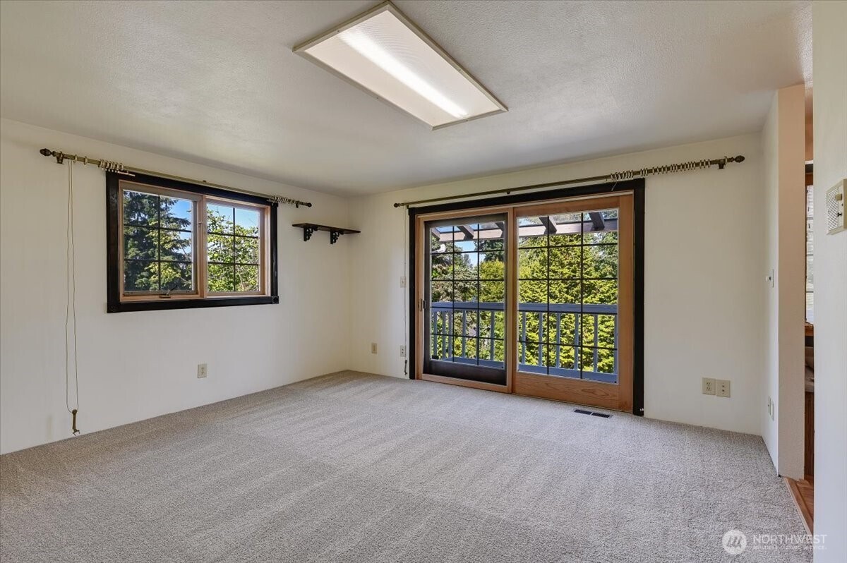 Primary suite with slider to private deck.