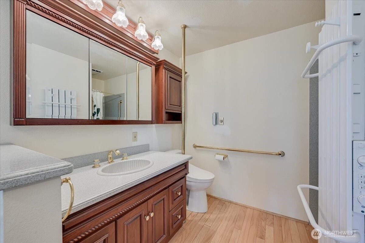 Updated Primary ensuite features a large jetted tub, separate shower, towel warming rack, and auto open/remote control bidet