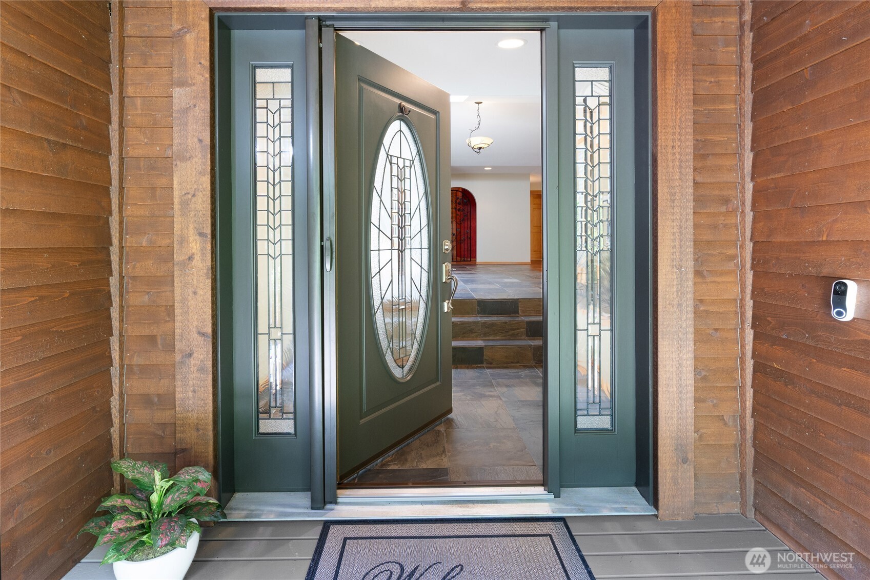 Entry with lighted coat closet.