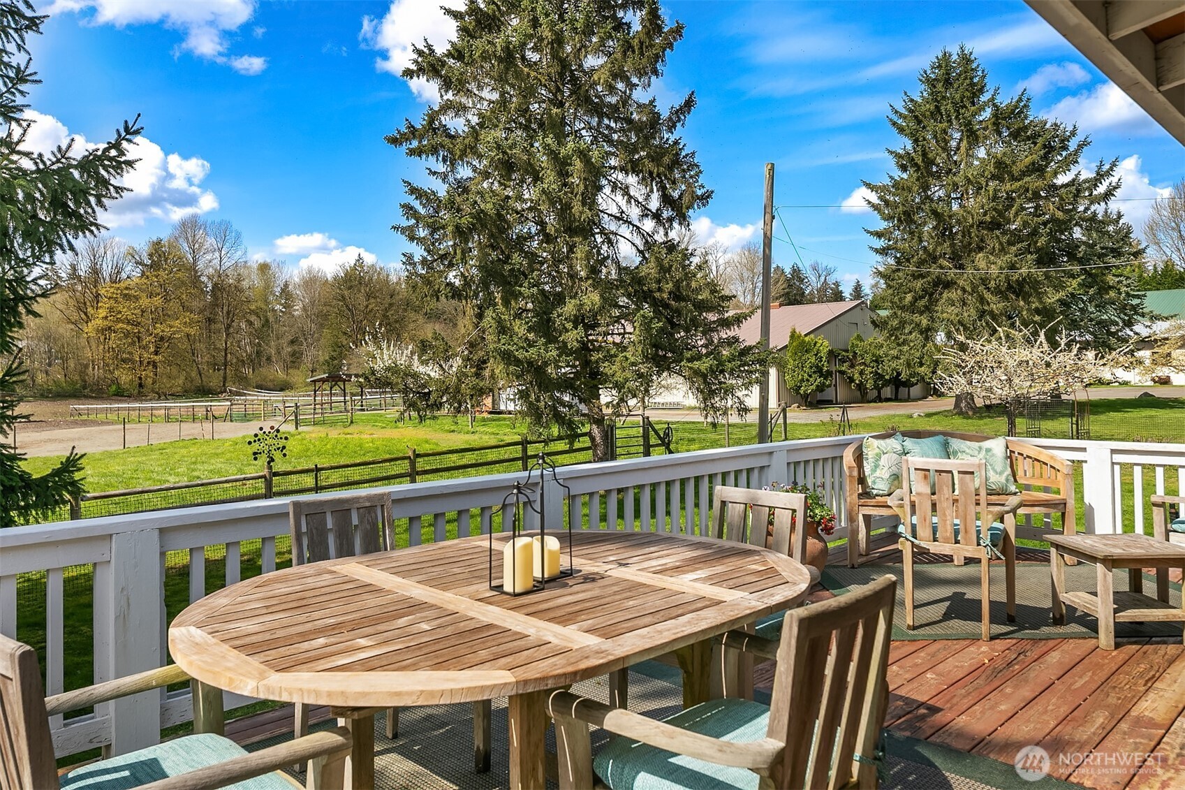 Large outside back deck looks out to private yard and