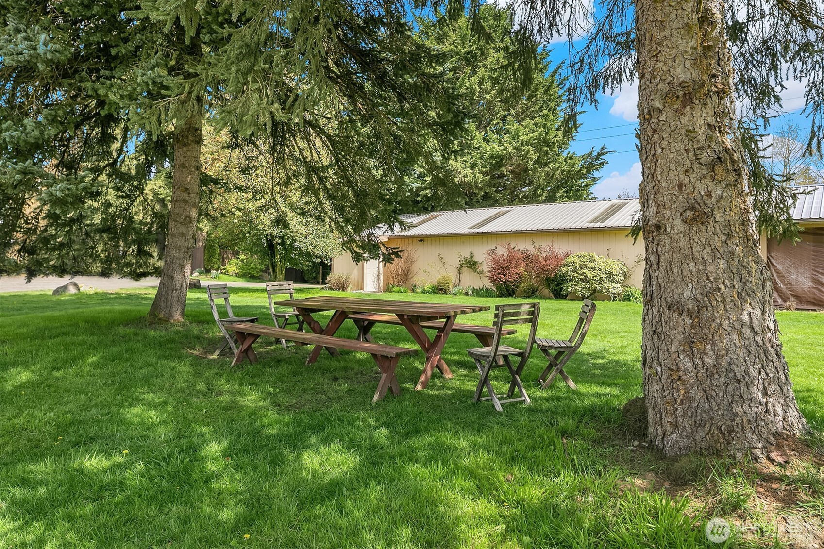 Sitting area looks to Hay Barn, Tool Shed and Facility RR.