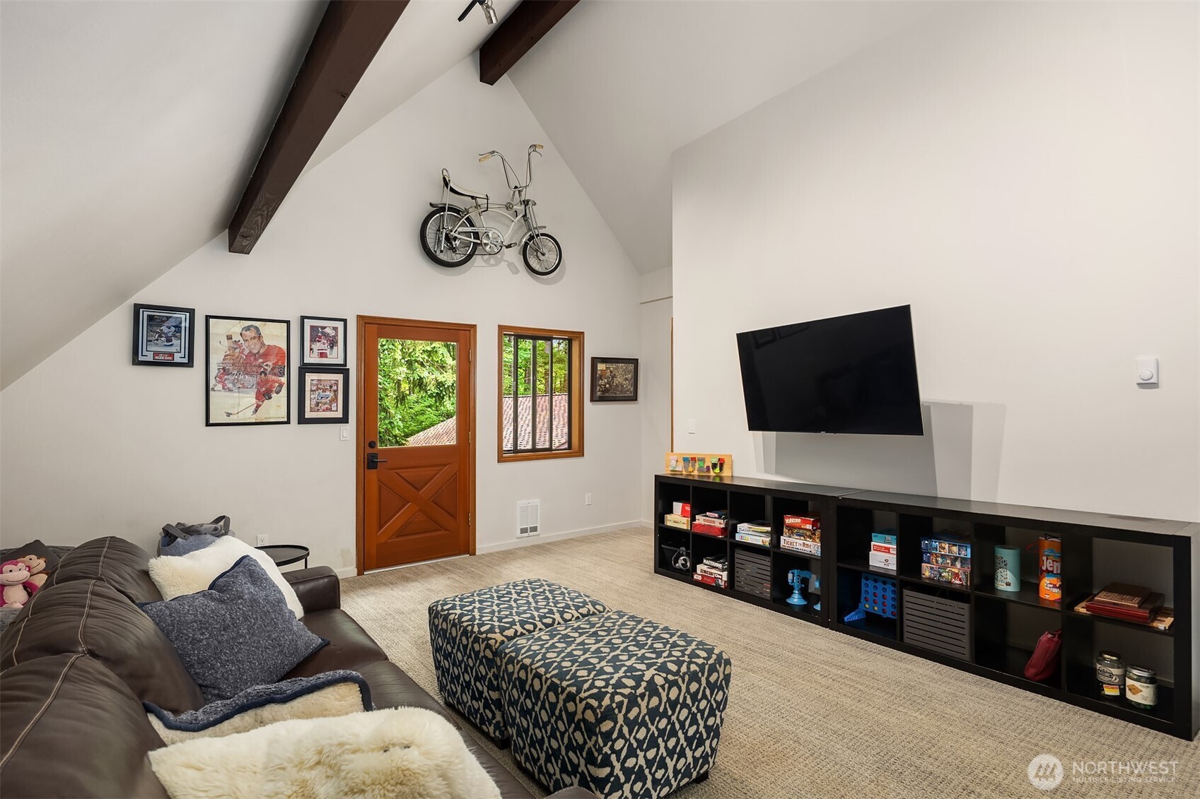 Another view of the upper level bonus room with access stairs to the back patio.