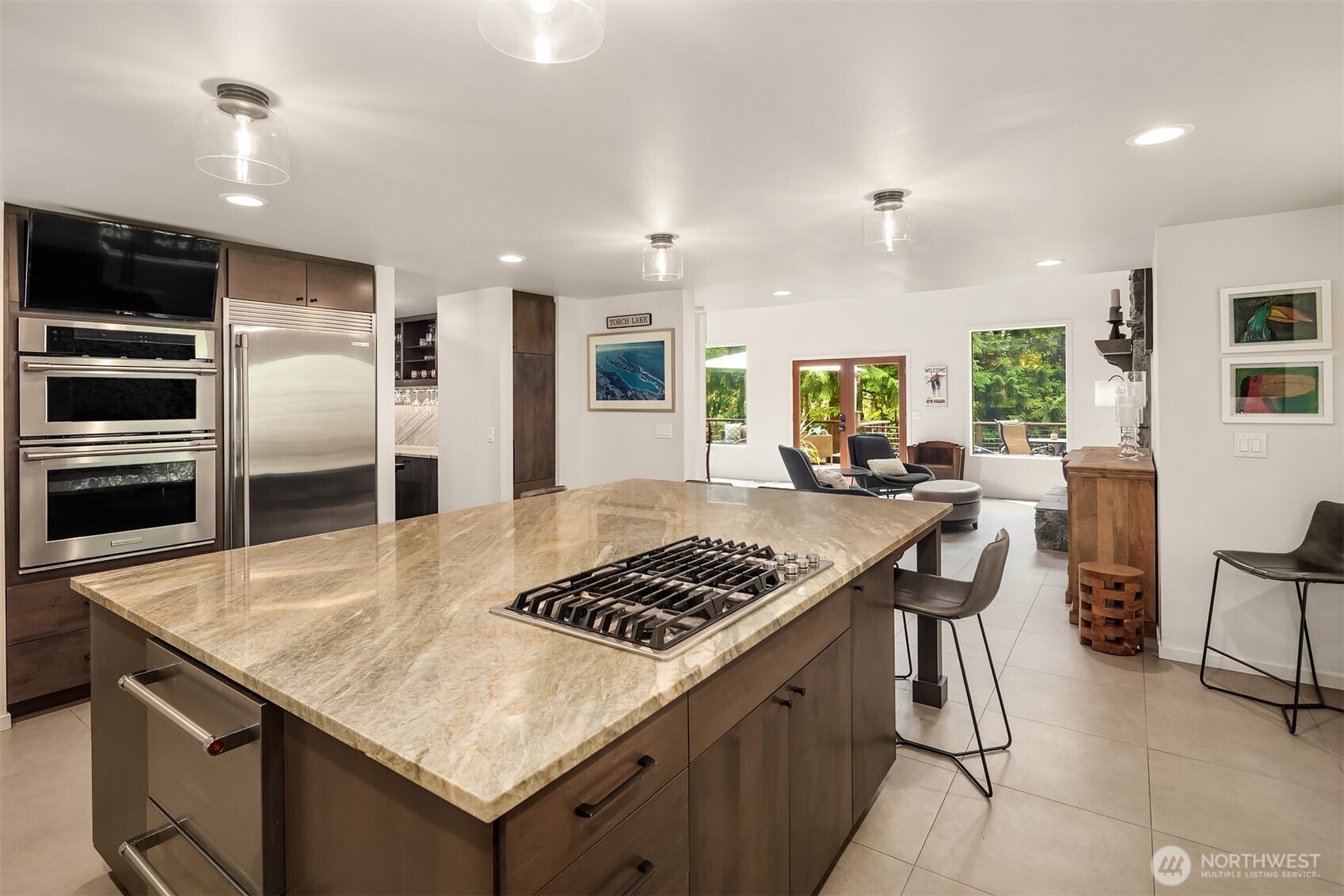 New stainless appliances and a gas cooktop on the island add to the appeal of this kitchen.